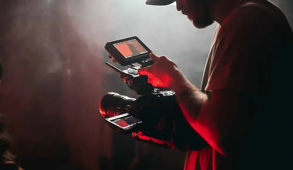 updating your website behind the scenes guy holding camera